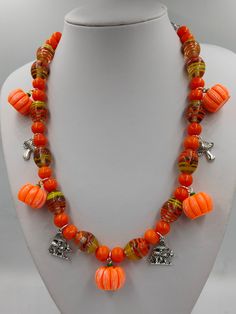 Alsmost Halloween: Pumpkin-time.  A one-of-a-kind  necklace withe beautiful glass beads and cute Pumpkins, Combined with a few mushrooms. The perfect autumn look. 1970s Mens Fashion, Barbie Halloween Costume, Cute Pumpkins, Pumpkin Necklace, Barbie Halloween, Autumn Look, Orange Slices, Cute Pumpkin, Handmade Necklace