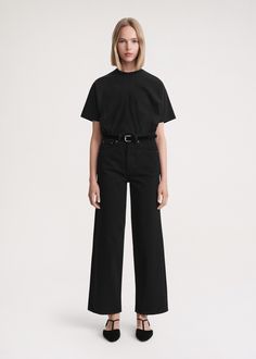 The high waist and wide legs of TOTEME's jeans are a nod to the 1970s. Made in Italy from rigid organic cotton that will soften with each wear, they feature belt loops and five pockets and are fitted on the hips before flaring toward the slightly cropped cuffs. Create a leg-lengthening illusion by styling them with a tucked-in top. Cropped Wide Jeans Outfit, Black Monochromatic Outfit, Black Wide Leg Jeans, Flare Jeans Outfit, Workwear Style, Capsule Wardrobe Outfits, Denim Outerwear, Black Flare, Workwear Fashion