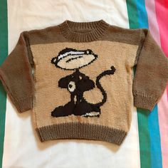 "🙊Vintage Handknit Monkey Sweater Really sweet vintage handknit monkey sweater in a crewneck style. In excellent vintage condition with no visible flaws!  The fabric feels like acrylic because it's nice and soft. I think it would fit 4/5 T but please check the measurements to be sure. This item is vintage so while I do my best to note any flaws, please expect some wear. A great vintage knit with lots of life left!  17\" shoulder to hem 15\" underarm to underarm 13\" sleeves 17\" across shoulders" Retro Brown Crew Neck Sweater, Brown Crew Neck Knitted Sweater, Handmade Brown Sweater With Long Sleeves, Casual Handmade Crew Neck Sweater, Vintage Hand Knitted Crew Neck Sweater, Handmade Knit Sweater With Crew Neck, Handmade Brown Knit Sweater, Monkey Gifts, Cute Clothing Stores