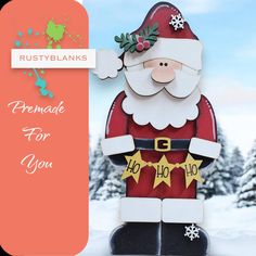 a paper cut out of santa claus holding a star in front of snow covered trees