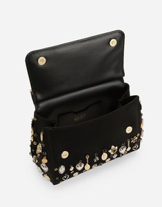 Medium satin Sicily handbag with embroidered charms: Black Front flap with hidden double magnetic fastening Branded tag featuring two metal plating finishes Top handle and adjustable, detachable strap in calfskin Calfskin lining Inner pocket with branded zipper and a cell phone holder Item comes with a branded dust bag Measurements: H18.5 x W20 x D10 cm Made in Italy Designer Bags With Metal Hardware, Gold Party Bag With Branded Hardware, Designer Clutch With Metal Hardware, Luxury Clutch Satchel As Fashion Accessory, Designer Clutch Flap Bag With Detachable Strap, Designer Flap Clutch Bag With Detachable Strap, Designer Flap Bag Clutch With Detachable Strap, Designer Evening Satchel With Metal Hardware, Designer Evening Shoulder Bag With Metal Hardware