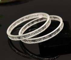 Solid silver handmade gorgeous customized design bangle bracelet, excellent personalized gifting bridesmaid jewelry from india.Metal-solid silver.Item type-Bracelet kadaWeight-15.910 grams  for single bangleSize-2-6 (6.0 cm or 2.375 " inner diameter)Width-0.5 centimeters.Silver purity-70%Quantity-1 pc(single)Make excellent gifting for birthday , mother's day, wedding, anniversary, father's day, Christmas day, valentines day, Silver Bangle Bracelet With Elegant Design, Silver Engraved Bracelets For Wedding, Handmade Round White Gold Bangle, White Gold Round Bangle For Gift, White Gold Round Bangle As Gift, Silver Engraved Bangle For Festive Occasions, Silver Engraved Round Bangle, Adjustable Traditional White Gold Bangle, Engraved Bangle Bracelet For Wedding