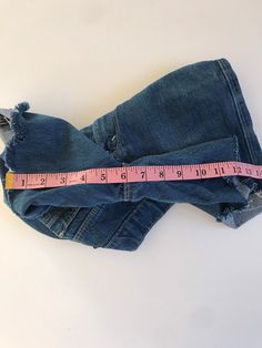 "Waist:26\" Rise:10.5\" Hips:32\" Inseam:6\" These are USA made Movin' On Levis zip fly cutoffs circa the late 70's or early 80's. They're tagged a vintage 28\" but fit a modern 26\" at largest. Please follow the measurements provided above and in the photos for an accurate fit as true vintage runs small and narrow. They're cut to the perfect unisex length and have amazing details on the pockets and feature a rare blue tab. 🍑(5)" Stretch Denim Cutoff Jean Shorts, Fitted Distressed Dark Wash Shorts, Stretch Cutoff Jean Shorts For Spring, Stretch Cutoff Shorts With Pockets, Vintage Jeans With Built-in Shorts For Spring, Spring Stretch Cutoff Jean Shorts, Medium Wash Stretch Cutoff Shorts, Stretch Denim Blue Cutoff Shorts, Stretch Denim Jean Shorts With Frayed Hem