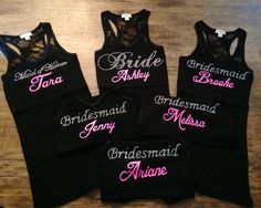 four bridesmaid tank tops on a wooden table