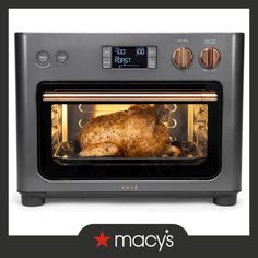 an oven with a chicken inside of it and the words, marcys on top