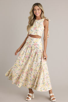 Model wearing ivory, pink and yellow matching top and maxi skirt set with tie strap details. Sorority Rush Dresses, Rush Dresses, Scallop Trim, Floral Maxi Skirt, Dress Bra, Dress Store, Long Crop Top, Floral Crop Tops, Little White Dresses