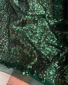 Emerald Green Sequin Fabric, Glitz Stretch Green Sequin Mesh Fabric by the yard. Mint Sequin Fabric for Wedding Decoration, Gowns, Fancy Table Runners, Curtains, Sequin Dress and more. Beautiful shiny iridescent sequins are sewn all over the mesh. Iridescent effect offers a different color from various positions, while the construction provides a flexible drape, perfect for overlaying darling skirts and dresses. Sheer and stretchy, this unique textile can be used for a large variety of projects, such as fitted dresses, gowns, formal wear, backdrops, curtain panels, elegant table runners, curtains, or any decorative endeavor. Content: Mesh, Sequins 3mm Sequins Color: Emerald Green Width: 56 inches Weigh: Approximately 11 oz per linear yard Light to Medium Weight Semi Sheer 2-Way Stretch Ple Festive Green Sequin Party Dress, Festive Green Sequin Dress For Party, Green Glamorous Sequin Fabric For Party Season, Green Glamorous Sequin Fabric For Festive Occasions, Glamorous Green Sequin Fabric For Party Season, Green Sequin Fabric For Evening And Party Season, Glamorous Green Sequin Fabric For Festive Occasions, Green Sequin Fabric For Party, Green Sequin Fabric For Party And Festive Occasions