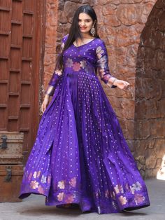 This stunning gown comes in a beautiful violet color with intricate zari weaving work, adding a touch of elegance and grace to your look.
Crafted from high-quality Banarasi silk, this fully stitched gown is available in sizes XS to XL, ensuring a perfect fit for every body type. The gown has a 4-meter flair and a length of 54 inches, offering a flowing and flattering silhouette.
Pair this violet gown with matching accessories and heels to complete your look and turn heads wherever you go.
This g Elegant Purple Kurta With Pallu, Purple Floor-length Traditional Wear For Navratri, Purple Kurta With Cutdana For Navratri, Semi-stitched Meenakari Anarkali Dress, Designer Art Silk Purple Kurta, Designer Purple Art Silk Kurta, Traditional Purple Floor-length Kurta, Floor-length Meenakari Dresses For Festivals, Elegant Purple Salwar Kameez For Navratri