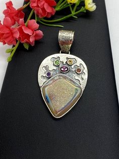 "ARTISAN RAINBOW DRUZY PENDANT Hand-made Sterling Silver 925. Stones used: Rainbow Druzy, Pink Tourmaline, Citrine, Green Sapphire, Garnet, Amethyst.. Height -2 9/16\" (including bail), Width - 1 1/16\" Height - 65mm (including bail), Width - 34mm Unique Handcrafted One-of a-kind Design Pendant Each Piece of Jewelry in my Collection is Absolutely One of a Kind! When you start wearing a piece of my jewelry you will fall in love with it more and more each day and feel that good Energy and Love tha Handmade Multicolor Sterling Silver Gemstones, Unique Multicolor Gemstones For Gift, Unique Multicolor Gemstones As Gifts, Artisan Multicolor Gemstones For Gift, Artisan Multicolor Gemstones As Gift, Unique Sterling Silver Gemstones For Gifts, Handmade Sterling Silver Gemstones For Anniversary, Handmade Multicolor Jewelry For Anniversary, Handmade Silver Fusion Gemstones