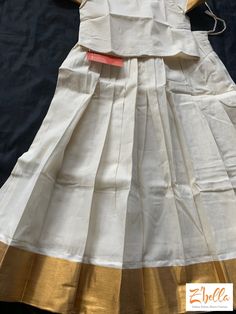 6-7 yr Kerala Gold Kasavu Skirt with off white crop top Fitted White Set With Long Skirt, Fitted White Long Skirt Set, White Fitted Long Skirt Set, White Festive Sets With Long Skirt, Festive White Set With Long Skirt, Festive White Sets With Long Skirt, White Festive Long Skirt Sets, Festive White Long Skirt Set, Fitted White Cotton Lehenga