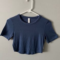 Nwt Lululemon Tight Cropped T-Shirt Blue. Fabric Is Soft And Breathable. Blue Fitted Workout T-shirt, Blue Crew Neck Crop Top For Workout, Fitted Blue T-shirt For Workout, School Wishlist, Lululemon Shirts, Weird Style, Crop Top Short Sleeve, Lululemon Shirt, Lulu Leggings