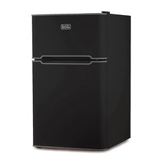 a black refrigerator freezer sitting on top of a white floor next to a wall