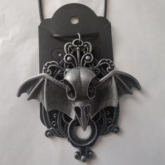 Handmade Plague Doctor Bat Pendant Necklace Kris' Hand Crafted Creations Measurements: Necklace Is 19" Total But Hangs Down Approx. 11" (Including The Charm) Like This? Check Out My Other Hand Crafted Creations. Keywords: Gothic, Plague Doctor, Steampunk, Bat, Halloween, Hand Crafted. New To Poshmark? Arrive Here From A Search? Create An Account And Use The Code Krisclosetoasis To Get $10 Off Your First Purchase! Welcome! Adjustable Gray Metal Necklace, Gothic Plague Doctor, Repurposed Necklace, Bat Pendant, Hand Beaded Necklace, Boho Jewels, Halloween Pendant, Bat Halloween, Rock Necklace