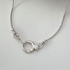 Solid 925 sterling silver rounded box chain, dainty 1.25mm width Solid Sterling Silver round push clasp, pendant clip, charm clip, 13mm width Shipping; Ships within one business day Free shipping in the USA Complimentary gift box with ribbon and wax seal stamp More items from my shop:  https://www.etsy.com/shop/LagunaLifeDesigns Minimalist Box Chain Necklace With Round Pendant, Elegant Sterling Silver Charm Necklace With Box Chain, Adjustable Sterling Silver Box Chain Necklace, Sterling Silver Round Box Chain Necklace, Silver Box Chain Necklace With Round Pendant, Silver Chain Necklace With Round Box Pendant, Sterling Silver Delicate Chain Necklace With Round Pendant, Minimalist Pendant Chain Necklace With Lobster Clasp, Sterling Silver Jewelry With Oval Link Box Chain