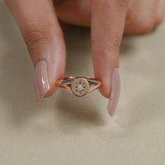 Natural Diamond Signet Ring/ 14K Rose Gold Elegant, Minimalist Design/ Dainty, Timeless Jewelry for Everyday Wear or Special Occasions/ Round Diamond Starburst Design SKU: IJS0031 ✯✯ 𝐃𝐢𝐚𝐦𝐨𝐧𝐝 𝐃𝐞𝐭𝐚𝐢𝐥𝐬 ✯✯ ➺ Shape: Round ➺ Color-Clarity: EF-VS/SI, GH-VS/SI, IJ-SI ➺ Size: 2.50 MM ➺ Weight: 0.050 CT ➺ Diamond Type: Natural Earth-Mined ✯✯ 𝐑𝐢𝐧𝐠 𝐃𝐞𝐭𝐚𝐢𝐥𝐬 ✯✯ ➺ Band Width: 1.80 MM ➺ Band Thickness: 1.70 MM ✯✯ 𝐆𝐨𝐥𝐝 / 𝐏𝐥𝐚𝐭𝐢𝐧𝐮𝐦 𝐃𝐞𝐭𝐚𝐢𝐥𝐬 ✯✯ ➺ It can be made in 10K/ 14K/ 18K Solid Gold & 950 Platinum. ➺ Gold metal tones can be made in Yellow, White & Rose. ✯✯ 𝐂𝐞𝐫𝐭𝐢𝐟𝐢𝐜𝐚𝐭𝐢𝐨𝐧𝐬 ✯✯ ➺ We offer IGI/GIA certifications as an optional service for an additional fee. If you would like to include certification with your purchase, please inform us before placing y 14k Rose Gold Signet Ring With Diamond Accents, Rose Gold 14k Gold Signet Ring With Diamond Accents, Celestial Rose Gold Diamond Ring In 14k Gold, Celestial Style 14k Rose Gold Diamond Ring, Fine Jewelry Rose Gold Signet Promise Ring, Rose Gold Signet Ring For Promise Fine Jewelry, Rose Gold Signet Promise Ring, Dainty Rose Gold Signet Ring Stamped 14k, Dainty Rose Gold Sterling Silver Signet Ring