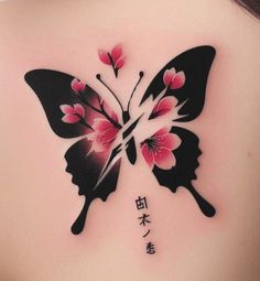 the back of a woman's shoulder with a butterfly tattoo on it, and chinese characters