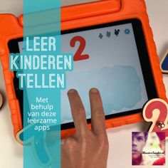 a child's hand on an orange and blue tablet