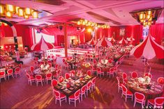 a banquet hall with red and white decor