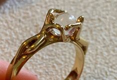 Pretty gold-plated character ring from the Charles Jourdan brand. 2 characters hugging a crystal ball. Size: 51EUR / 16.3mm In very good vintage condition. Gold Moonstone Ring Collectible, Characters Hugging, Vintage Bangle Bracelets, Charles Jourdan, Pretty Ring, Onyx Marble, Vintage Bangles, Hand Ring, Pretty Rings