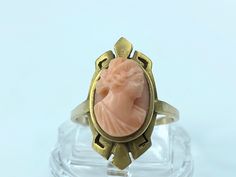 Art Nouveau 10K Yellow Gold Coral Cameo, hand carved a high detail delicate Coral Cameo in a deliated frame, ring top is 21.5mm, ring size 7, 4.1g, hallmark 10K Victorian Yellow Gold Carved Rings, Victorian Carved Yellow Gold Rings, Antique Carved Collectible Ring, Art Deco Cameo Ring For Collectors, Art Deco Cameo Ring Collectible, Victorian Oval Carved Rings, Art Deco Cameo Collectible Rings, Formal Carved Fine Jewelry Rings, Antique Carved Rings Perfect For Gifts