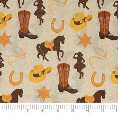 the fabric has cowboy boots and stars on it