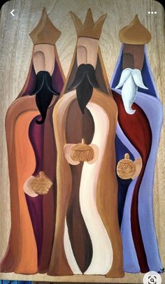 the three graces are painted on wood with different colors and shapes, including black, brown, blue, red, orange