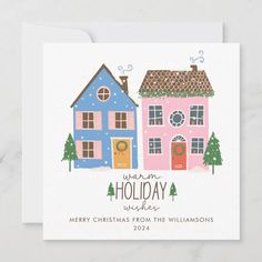 a christmas card with two houses on the front and one in the back, which reads warm holiday wishes