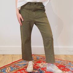 The Frayed Ranger Pant. Is A Refined Take On Classic Utility Styles. It Has A Vintage, Tomboy Feel And Is Intended To Sit Low On The Hips With A Slightly Cropped Length. Its Classic Army Details And Frayed Hem Make These Pants Feel Authentic. It Has Those All Important Side Pockets And Two On The Back With Flap And Button Detailing. Made From 100% Cotton. Machine Wash Cold, Tumble Dry Low Fall Utility Bottoms With Cropped Leg, Fall Utility Cropped Leg Bottoms, Fall Utility Cropped Bottoms, Fall Utility Cropped Pants, Khaki High-waisted Pants For Fall, Fall Khaki High-waisted Pants, Trendy Tapered Leg Pants With Patch Pockets, Khaki High-waist Relaxed Fit Pants, High Waist Relaxed Fit Khaki Pants