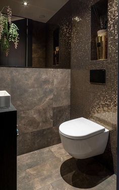 a toilet and sink in a very modern bathroom