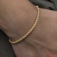 Introducing the Palm Chain Bracelet in Yellow Gold, the bolder 4mm version. This versatile 18k Yellow Gold bracelet features a braided rope design that will instantly level up your look. This piece is ideal for stacking and accessorizing any outfit- day or night. Pair it with the Palm Necklace in 4mm for the perfect matching set! This product is guaranteed for life – GLD will repair or replace the item should you experience any defects in craftsmanship or breakage. Specifications - Width: 4mm - Luxury Yellow Gold Braided Bracelet Gift, Palm Necklace, White Gold Bracelet, Braided Rope, Vermeil Jewelry, Rope Design, Custom Earrings, Yellow Gold Bracelet, Gold Plated Bracelets