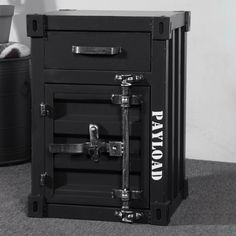 a black and white photo of an old fashioned safe