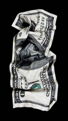 an image of money wrapped in a scarf on top of each other with the words, $ 100 bill printed on it