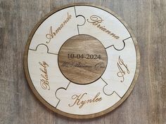 a personalized wooden puzzle with names and date on the front, as well as two hearts