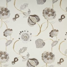 a white and brown floral print fabric with small flowers on the bottom half of it