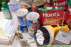 the contents of an emergency food box are spread out on a table with scissors and other items