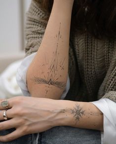 a woman with a star tattoo on her arm