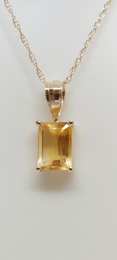 "CITRINE 14k Yellow Gold Pendant / Necklace. Natural stone. 18\" gold Chain necklace. Rectangle Gemstone Jewelry. Yellow Citrine. November Birthday Stone. Product Info: - Stone: Rectangle Yellow Citrine. - Color: Yellow. - Pendant Measures: 12mm x 4mm. - Stone Measures: 5x4mm - Stone Carat: 0.85 - Metal: 14k Yellow Gold. - Chain Length: 18 inches Rope Chain. - Made in USA. - Nice Gift Box Included." Yellow Stone Necklace, Hallmarked Gold Jewelry With Rectangular Stone, Rectangular 14k Gold Hallmarked Necklace, Yellow Gold Rectangular Diamond Cut Necklace, Luxury Citrine Necklace For Formal Occasions, 14k Gold Rectangular Hallmarked Necklaces, Yellow Gold Necklace With Rectangular Stone For Anniversary, Rectangular Yellow Gold Necklace With Diamond Cut, Yellow Gold Rectangular Birthstone Jewelry