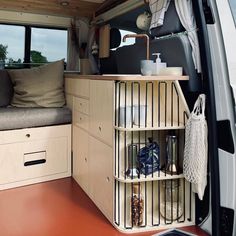 the inside of a van with shelves and storage