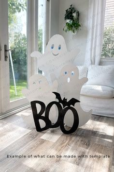 a halloween decoration with ghost and boo on it