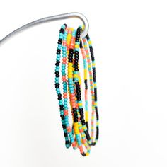 Add a touch of vibrant color and unique craftsmanship to your wardrobe with this exquisite Set of 6 Seed Bead Bracelets! Whether you're dressing up for a special event or adding a pop of color to your everyday attire, these seed bead bracelets are the perfect accessory. Each bracelet is carefully handcrafted by talented artisans in Guatemala, using high-quality, colorful seed beads. There are two different flavors to choose from, so whether you're bold and elegant like Sangria, or fun and peppy Festival Tiny Beads Bangle Bracelet, Festival Bracelets With Tiny Beads, Multicolor Tiny Beads Wrap Bracelet For Friendship, Festival Multi-strand Bracelets With Tiny Beads, Faceted Round Beads Friendship Bracelets For Festivals, Friendship Bracelets With Faceted Round Beads For Festivals, Festival Friendship Bracelets With Faceted Beads, Multi-strand Tiny Beads Bracelet For Festival, Festival Multi-strand Beaded Bracelets With Tiny Beads