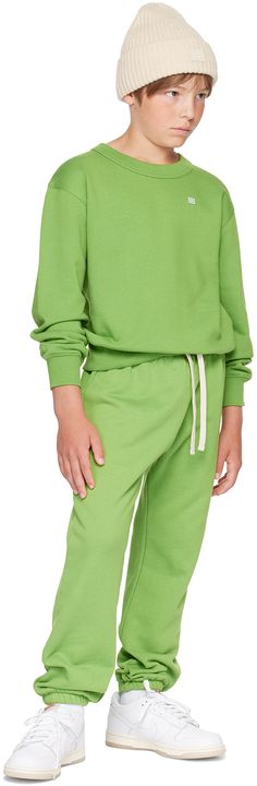 GOTS-certified organic cotton French terry sweatpants. · Drawstring at elasticized waistband · Three-pocket styling · Embroidered logo patch at front · Machine-wash Supplier color: Herb green Model measures 54” / 137.2 cm tall and wears size 8-10Y. Acne Studios Size: child's height 3-4Y: 38.5-40 / 98-104 cm 4-6Y: 40-45.5 / 104-116 cm 6-8Y: 45.5-50 / 116-128 cm 8-10Y: 50-55 / 128-140 cm Green Urban Cotton Sweatpants, Playful Green Cotton Sweatshirt, Acne Studios Sweatshirt, French Terry, Acne Studios, Patch Logo, Rib Knit, Kids Shop, Sweatpants