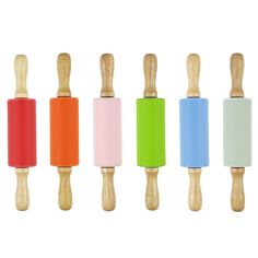 four wooden pegs with different colors on them and one has a rubber handle for the top