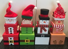 a group of wooden blocks with christmas decorations on them