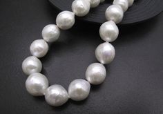 Material : Genuine Natural Freshwater Pearls Quantity : One Necklace Length : 17.5 inch with extender adjustable to 20 inch (including the silver toggle) Color : White Baroque Pearls as pictured Bead Shape : Irregular Baroque Pearls as pictured Bead Size 10-12 mm approx. Clasp Size : 14mm Spring Clasp Lead Time & Shipping : We will ship your order in 1-3 business day once order received. If we offer FREE DOMESTIC shipping, package will be shipped via USPS First Class mail on orders shipping Classic White Round Beads Bridal Necklace, White Pearl Drop Bridal Necklace, Classic White Bridal Necklace With Round Beads, Classic White Bridal Necklace With Pearl Drop, Formal White Single Strand Bridal Necklace, Pearl Necklace Bridal, Dainty Pearl Necklace, Tahitian Pearl Necklace, Bridal Pearl Necklace