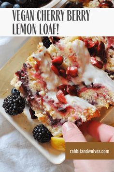 vegan cherry berry lemon loaf on a plate with berries