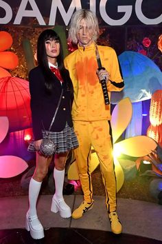 two people in costumes standing next to each other