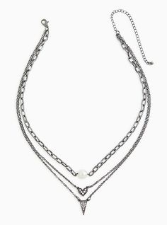 Make an eye-catching statement with this layered necklace, featuring a faux pearl charm, a heart pave charm, and ending with a triangle pave charm. Lobster clasp. 19-21” with 5” extender. Base metal. Imported. The best plus size women's hematite-tone pave triangle layered necklace necklaces in silver. Torrid is your destination for the freshest spring and summer styles. Triangle Necklace, Pretty Necklaces, Summer Styles, Faux Stone, Pearl Charms, Accessories Jewelry Necklace, Layered Necklace, Bra Cups, Base Metal