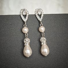 "Original Design by Glamorous Bijoux© These classic yet elegant bridal earrings feature modern vintage style petite teardrop shaped pendants in silver (rhodium) finish, bejeweled with sparkly rhinestones. Delicately hand-linked with lovely drops, consisting of Swarovski pearls, silver rhinestone spacers, luxurious rhinestone balls, and teardrop shaped pearls. Measurements: Length measures approximately 1-7/8\" from top. ❥ Earrings can be customized as follows: (1) FINISH: SILVER (default as show Pearl Drop Dangle Clip-on Earrings For Wedding, Crystal Pearl Drop Dangle Bridal Earrings, Teardrop Pearl Drop Clip-on Earrings For Wedding, Crystal Pearl Dangle Earrings For Wedding, Crystal Dangle Pearl Earrings For Wedding, Genuine Turquoise Jewelry, Crystal Earrings Swarovski, Dangle Earrings Wedding, Crystal Earrings Wedding