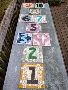 colorful tiles are laid out to spell the number one, two, three and five