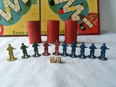 several toy figurines are shown in front of a board game